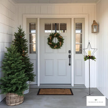 Load image into Gallery viewer, Front door with wreath, Christmas tree, and the decorative Star shaped tall candle holder on a porch.
