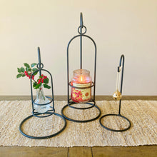 Load image into Gallery viewer, Amish handmade wrought iron countertop hook stand with candle. Set of three decorative candle holders on a wooden surface with a neutral background.