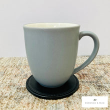 Load image into Gallery viewer, Black Thick Leather Coaster holding a coffee mug
