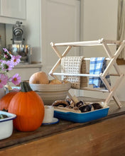 Load image into Gallery viewer, Small Accordion Drying Rack on a table holding tea towels.  This drying rack can be used for all sorts of small items, tea towels, baby clothes, socks, mittens or use it as a candle drying rack for freshly dipped candles.