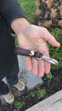 Load and play video in Gallery viewer, video of a man holding the keychain and opening and closing the clasp