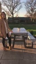 Load and play video in Gallery viewer, Woman demonstrating how to pull cording to cinch table cover to secure on table