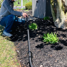 Load image into Gallery viewer, Wrought Iron Garden Hooks can be used as a hose guide or a plant stake.  Picture shows a man pulling a hose under the hook that keeps the plants protected from the hose.