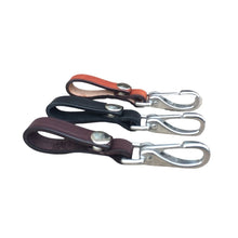 Load image into Gallery viewer, 3 leather key holders pictured from the side showing snaps and stainless steel clasp.
