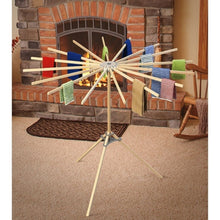 Load image into Gallery viewer, wooden drying rack set up next to a fireplace
