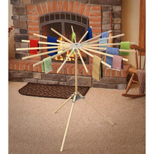 Load image into Gallery viewer, wooden drying rack set up next to a fireplace