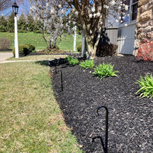Load image into Gallery viewer, Powder Coated Garden Hook Décor along the edge of a flower bed.  Can also be used along the edge of a vegetable garden.  Garden hook stakes protect plants from hose when it is dragged or adjusted.