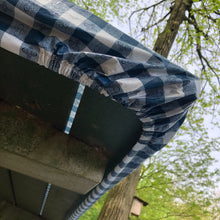Load image into Gallery viewer, Bottom angle of picnic table showing cinched table cover