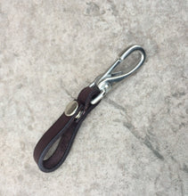 Load image into Gallery viewer, A single dark brown leather key holder with snap.