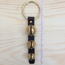 Load image into Gallery viewer, 3 Sleigh Bells on ring next to tape measure to show length
