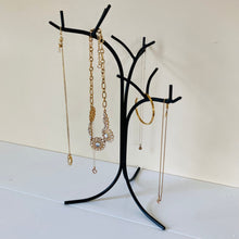 Load image into Gallery viewer, Side angle of the black metal jewelry tree stand organizer.