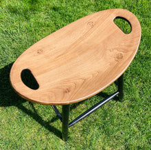 Load image into Gallery viewer, Top angle of saddle stool with a special walnut stained seat.