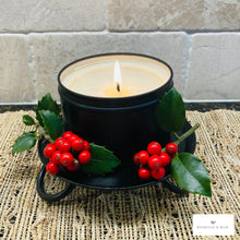 Load image into Gallery viewer, Candle in a black holder with red berries and green leaves on a textured surface. Candle plate stands fit 3 inch pillar candle nicely and add farmhouse style to your Christmas and home decor.
