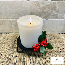 Load image into Gallery viewer, White candle with a flame on a textured surface, accompanied by holly leaves and berries.  Candle holders can be used to add a touch of rustic Christmas charm to your home decor.
