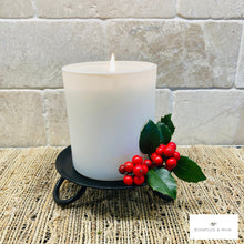 Load image into Gallery viewer, White candle on black holder with red berries and green leaves on a textured surface.  Rustic metal candle holders can be used for your Christmas table centerpiece or mantel.
