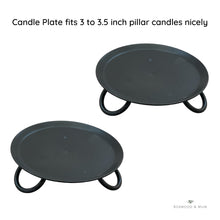 Load image into Gallery viewer, Two black candle plates on a white background with text indicating that they fit 3 to 3.5 inch pillar candles nicely.

