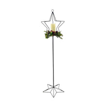 Load image into Gallery viewer, Decorative star-shaped candle holder with a candle and Christmas greenery on a white background.  Please note that the greenery and candle are not included with the stand.  
