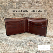 Load image into Gallery viewer, Brown leather wallet on a textured surface with 'Heirloom Quality | Made in USA' text above it.
