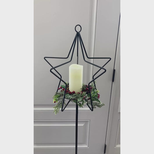 Video that starts at the top of the top metal star and then pans down to the star style base and back to the top of the star again.  