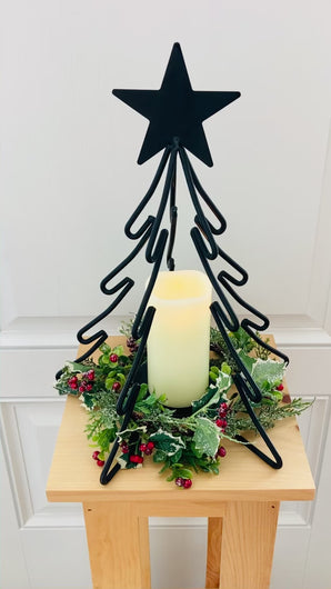 Christmas Table Centerpiece.  Black painted metal Christmas Tree with candle holder in the middle.