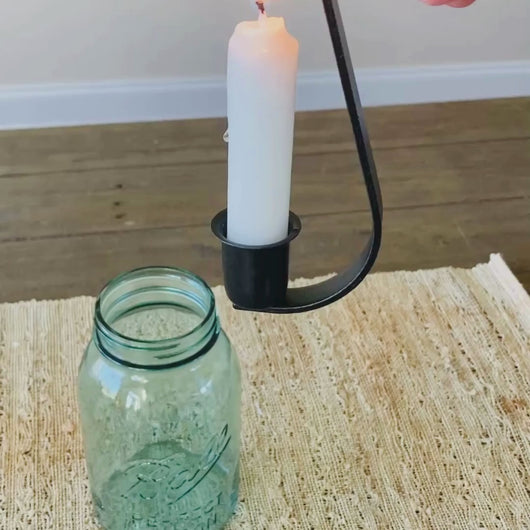 Video of the candle hook holding a candle and being placed into a Blue Vintage Ball Mason Jar