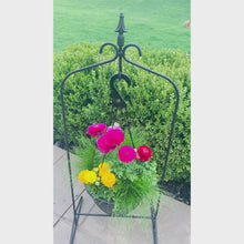 Load and play video in Gallery viewer, Close-up of curved wrought iron hook for hanging flower baskets or lanterns
