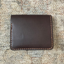 Load image into Gallery viewer, Brown leather trifold wallet on a textured surface
