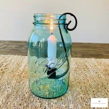 Load image into Gallery viewer, Vintage Ball Glass Jar with a wrought iron taper candle holder hooked onto the side of the jar mouth
