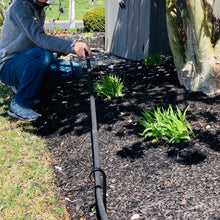 Load image into Gallery viewer, Wrought Iron Garden Hooks can be used as a hose guide or a plant stake.  Picture shows a man pulling a hose under the hook that keeps the plants protected from the hose.
