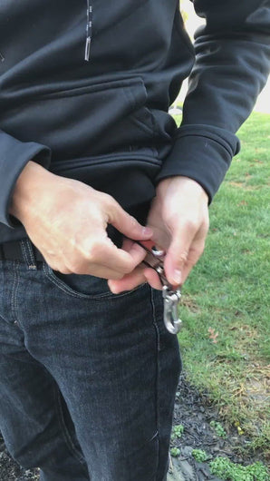 video of a man demonstrating how to put the snap keychain on a belt