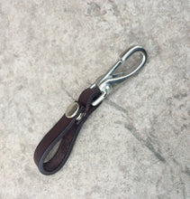 Load image into Gallery viewer, A single dark brown leather key holder with snap.
