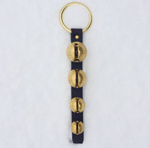 Load image into Gallery viewer, 4 solid brass bells attached to a dark brown leather strap with a brass plated ring door hanger
