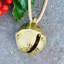 Load image into Gallery viewer, Close up of the solid brass sleigh bell with holly berries and leaves
