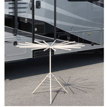 Load image into Gallery viewer, 16-arm wood drying rack set up in front of an RV
