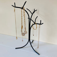 Load image into Gallery viewer, Side angle of the black metal jewelry tree stand organizer.
